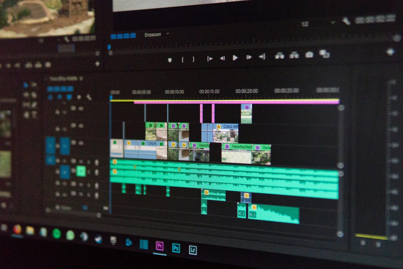 Home Close-up of a video editing timeline interface on a computer screen, showcasing professional software in action.
